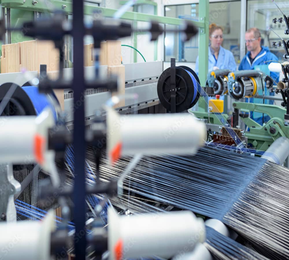 fiber manufacturing equipment with workers